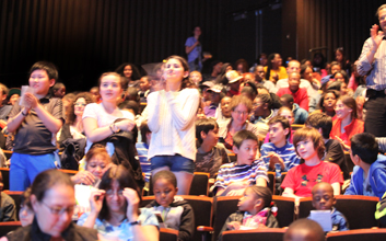 Photo of students applauding in our Zellerbach Theatre