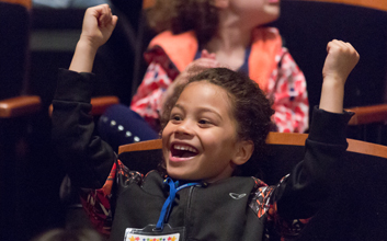 Excited girl in the audience at the Children's Festival